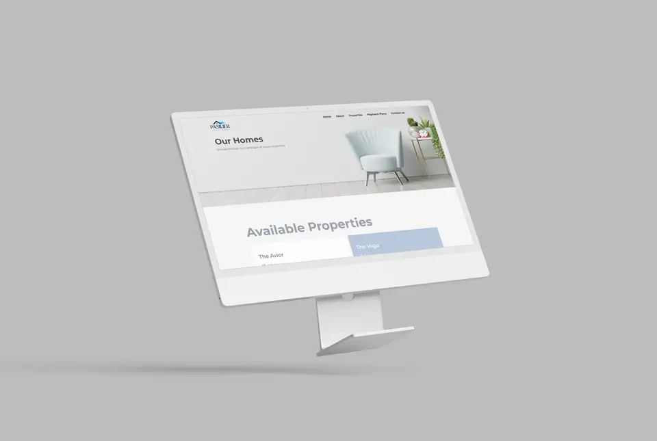 Three monitors showing Our Homes and available properties, including The Aviar and The Vega.